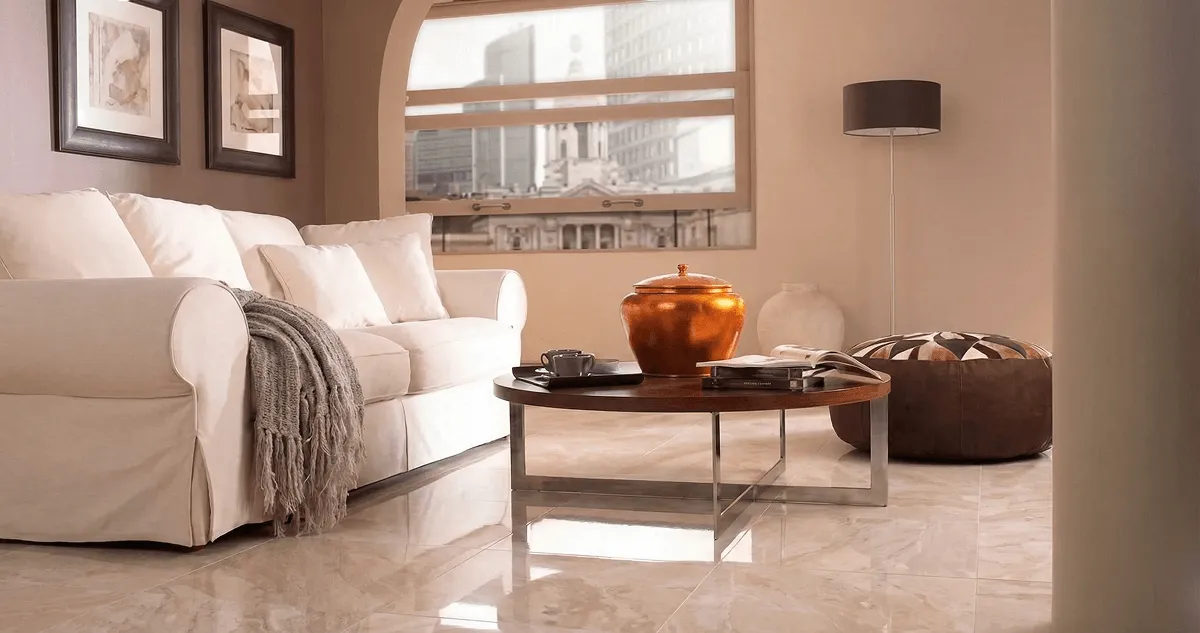 Modern living room with professionally installed marble flooring, a beige sofa, coffee table in Tuscaloosa, AL